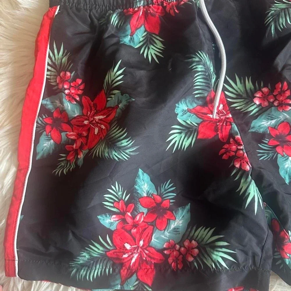 Forever 21 red and green floral swim shorts with white trim, size XL